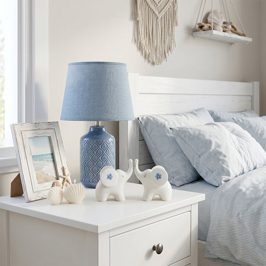 ceramic elephants on bedside nightstand