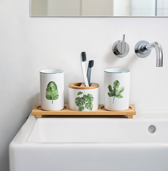 4-piece ceramic bathroom set near the sink