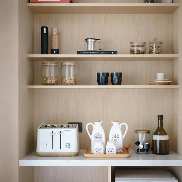 4 piece ceramic seasoning bottle set on the cabinet