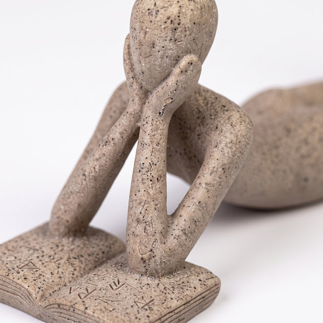 Abstract Figure Reading Book Close Up