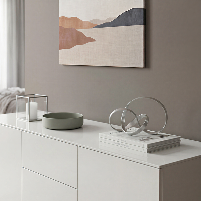 Abstract loop statue on white sideboard console