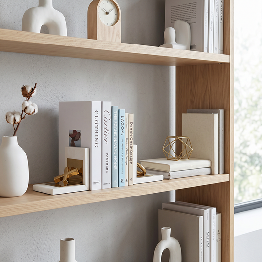 Bookends displayed on wood shelf