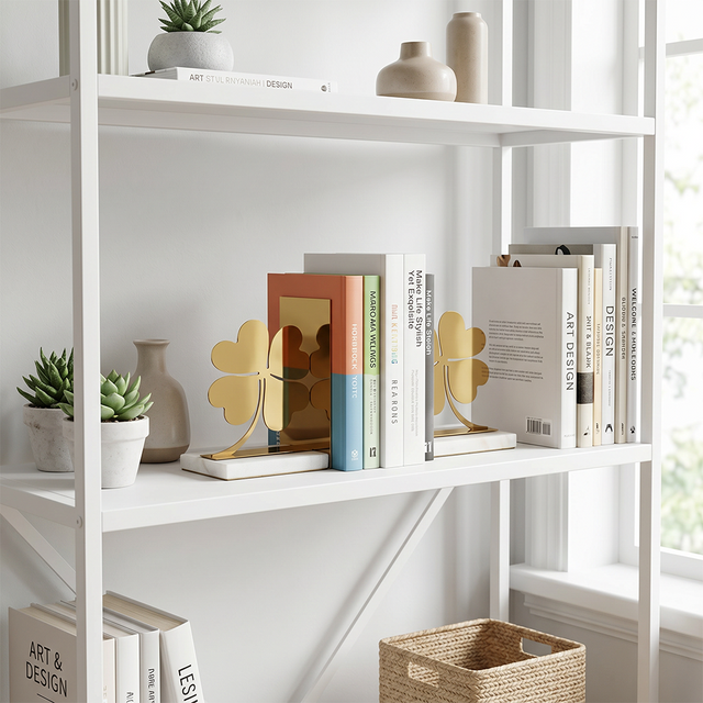 Bookends on white open bookshelf