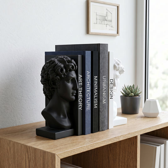 Bust bookend set on rustic wood office desk
