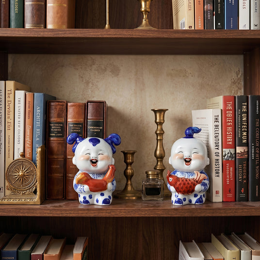 Ceramic pair displayed on wood bookshelf