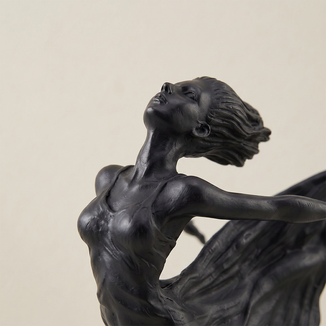 Closeup black bronze ballerina figurine