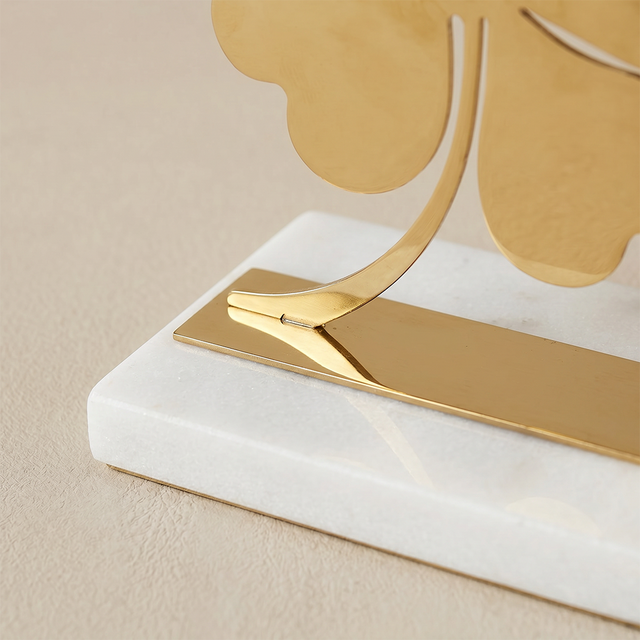 Closeup gold clover bookend detail
