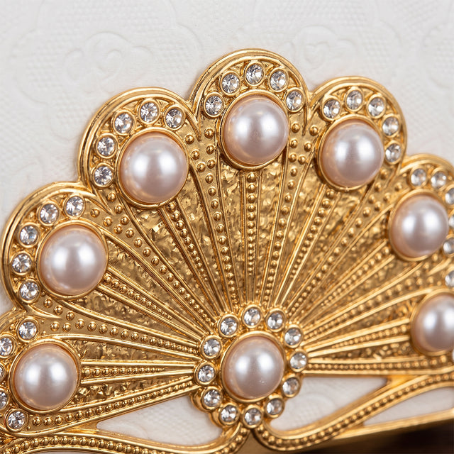 Closeup pearl encrusted gold fan top
