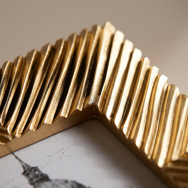 Corner detail of gold picture frame