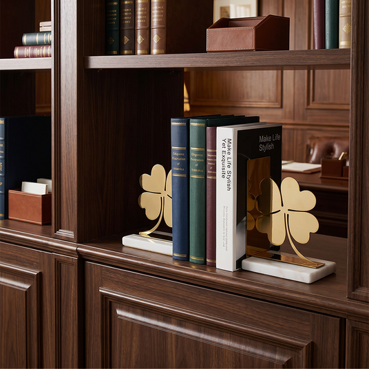 Decor bookends on dark cabinet
