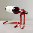 Elegant Floating Metal Ribbon Wine Rack Creative Balancing Sculpture for Modern Home Office Decor 090928