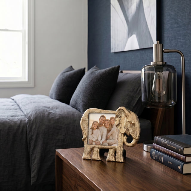 Frame placed on bedside wood table