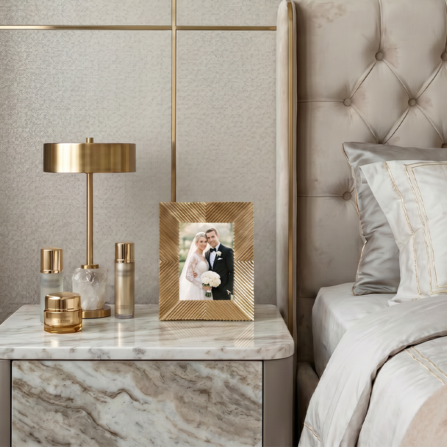 Frame placed on marble nightstand