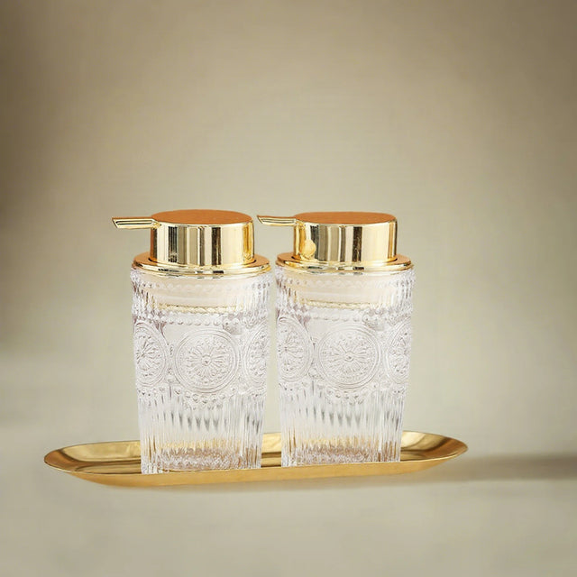 Glass Bathroom Dispenser Set on the table