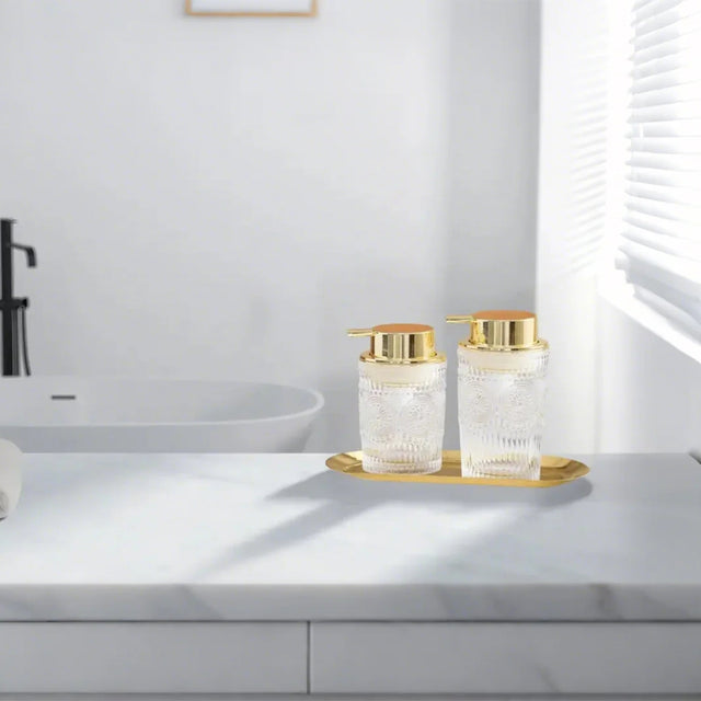 Glass Bathroom Dispenser Set on the table
