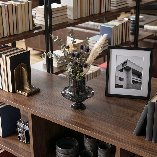 Glazed pedestal pot on dark wood console table