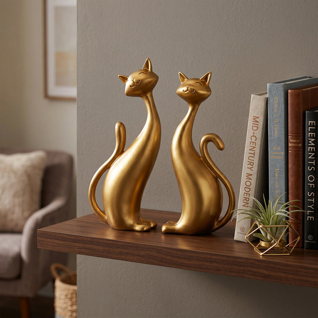 Gold Cat Sculptures On Wooden Shelf