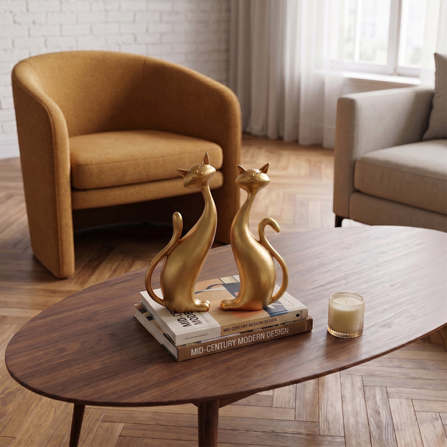 Gold Cat Sculptures On Wooden Table