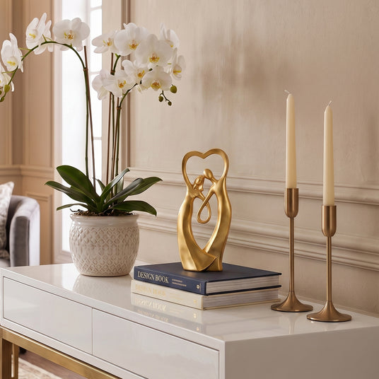 Gold Couple Sculpture On White Console