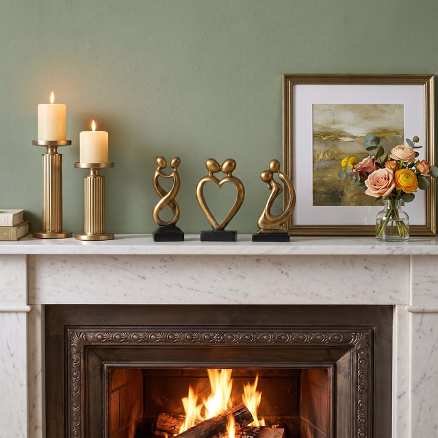 Gold Couple Sculptures On Fireplace Mantel
