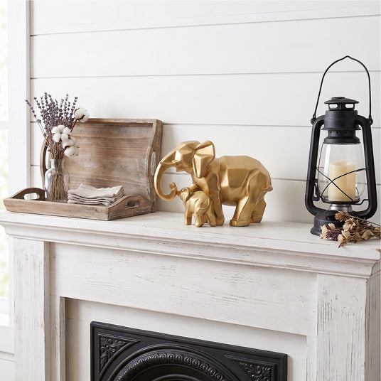 Gold Elephant Decor On White Mantel