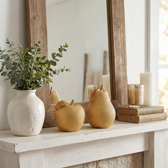Gold Fruit Set On White Mantel