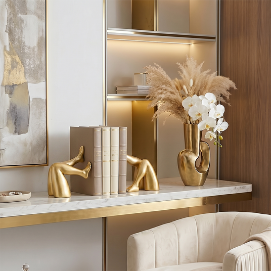 Golden bookends vase flowers luxury table