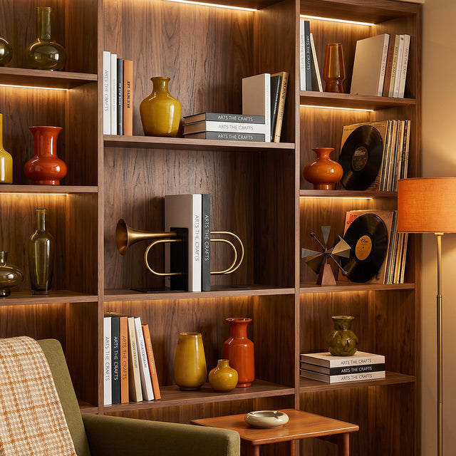 Golden instrument bookends inside display library shelf