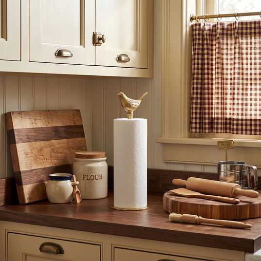 Goldentowel holder on dark wood kitchen countertop
