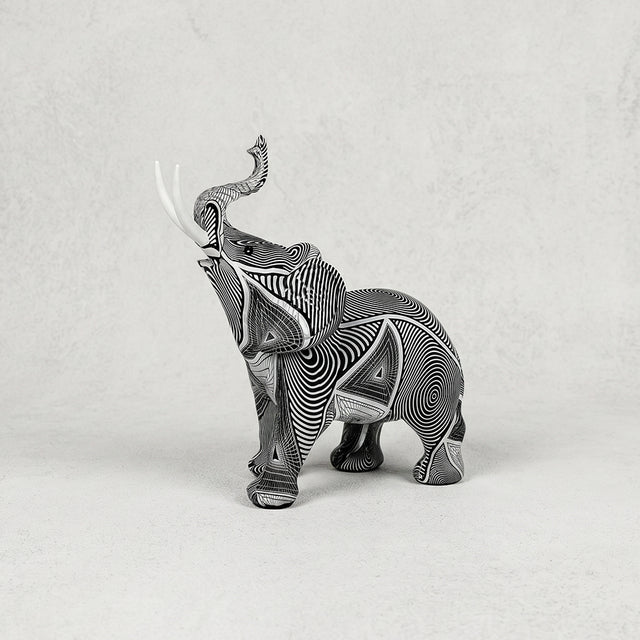 Grey carved elephant resin figurine with upward trunk