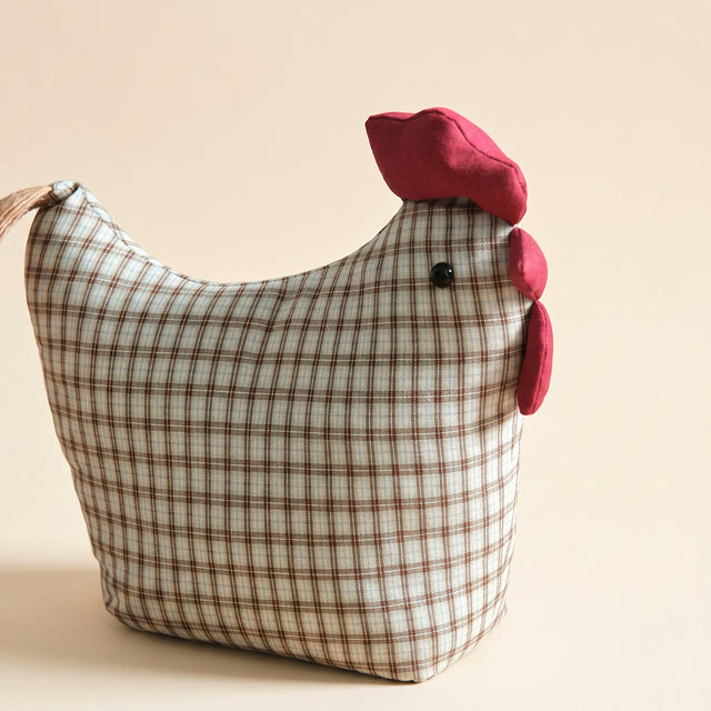 Grey check chicken figurine closeup