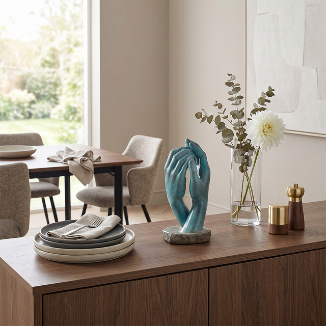 Hand sculpture on dining room sideboard