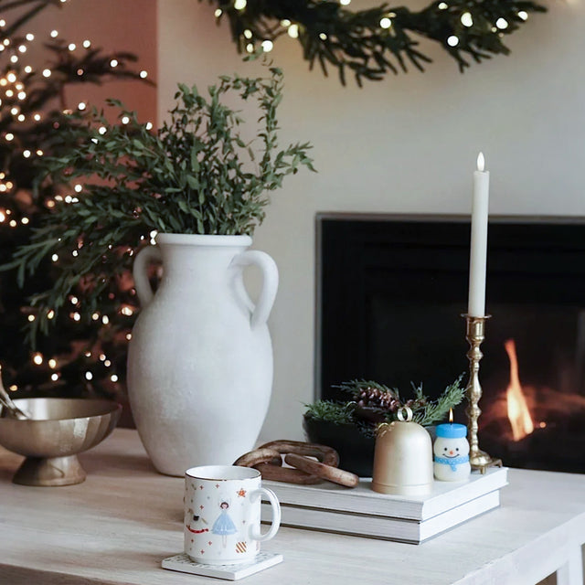 Handcrafted Snowman Aromatherapy Candle On The Stacked Books 090521