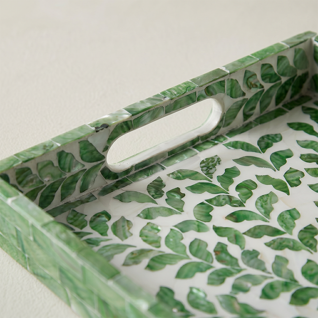 Handle cutout green foliage tray closeup