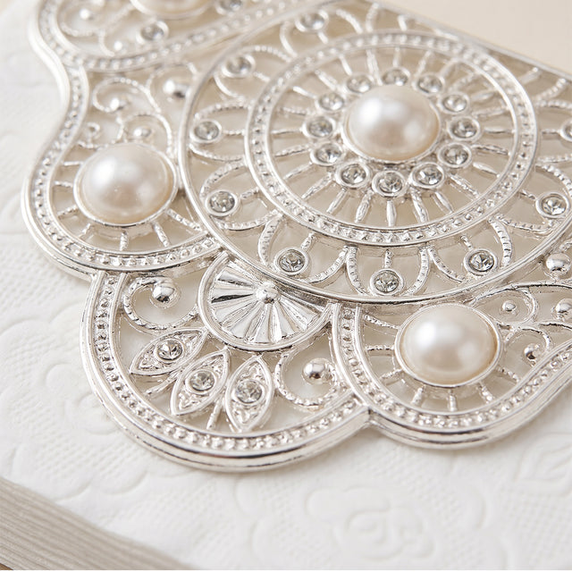Intricate rhinestone pearl carving detail