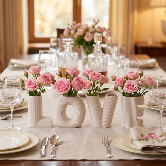 LOVE vases on dining table with pink roses