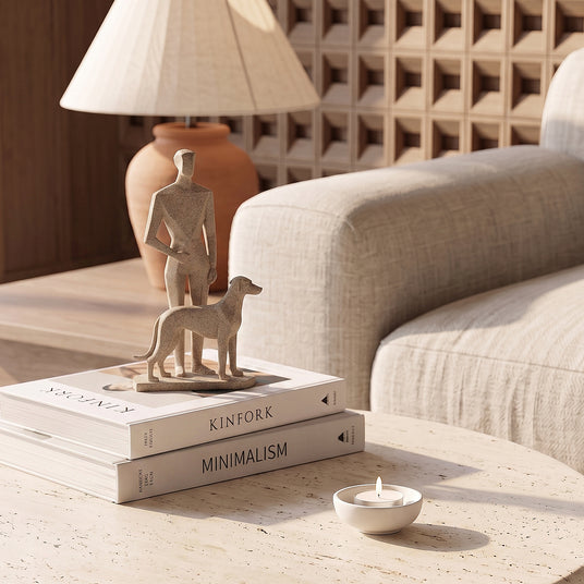 Man And Dog Sculpture On Coffee Table