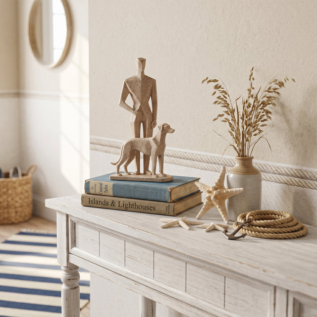 Man And Dog Sculpture On White Console