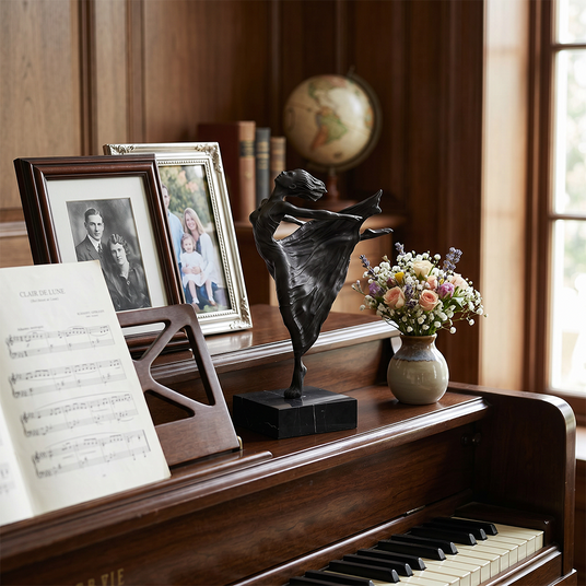 Sculpture placed on vintage wood piano