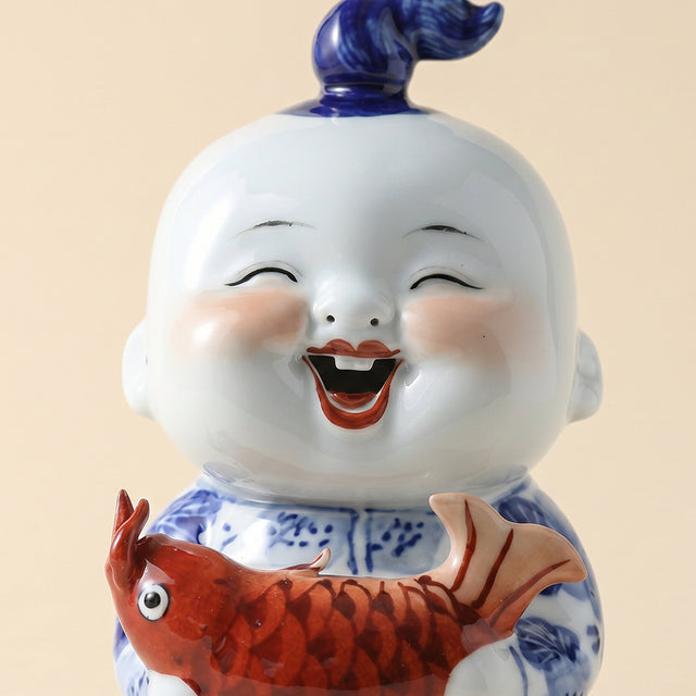 Single blue white child fish sculpture
