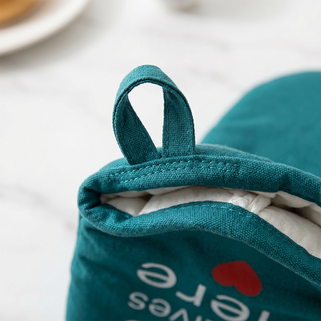 Teal oven glove close shot