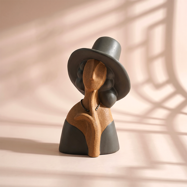 Two tone clay lady with wide hat bust sculpture