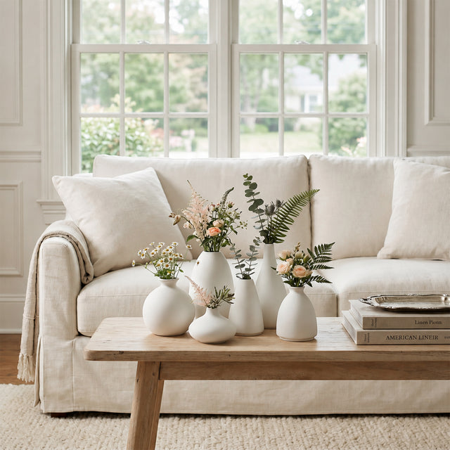 White Vases With Flowers On Coffee Table
