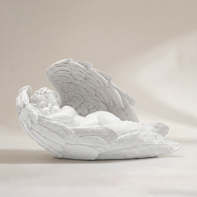 White sleeping cherub angel statue