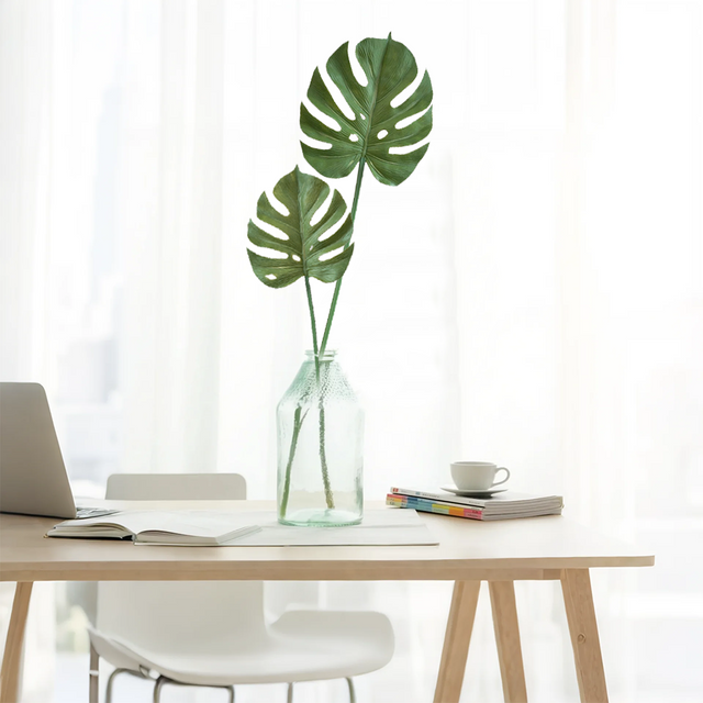artificial monstera leaves in living room
