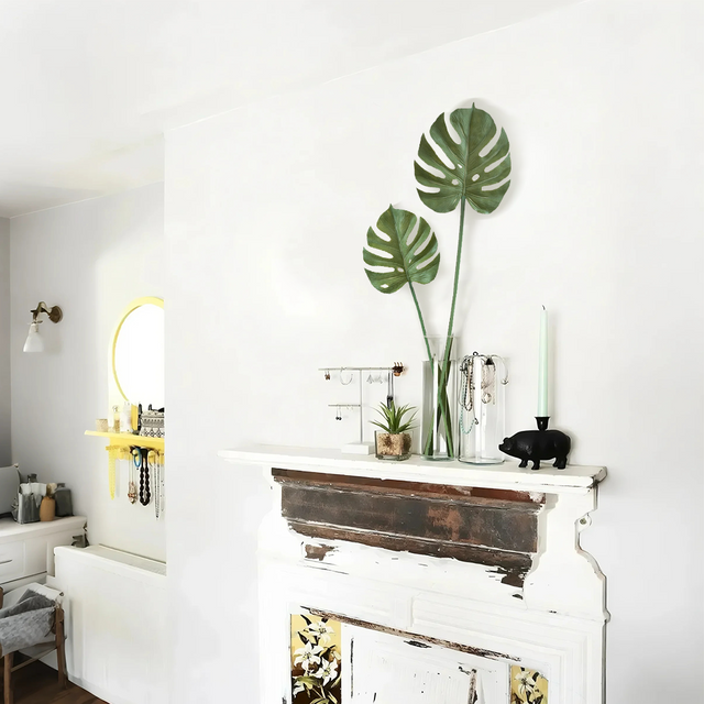 artificial monstera leaves in vase