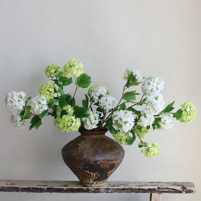 artificial snowball flower on the shelf