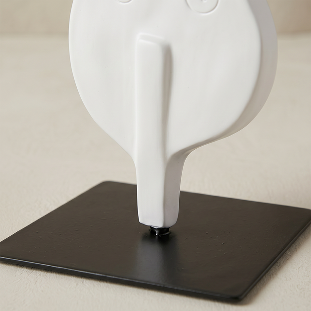 base detail of white cello sculpture