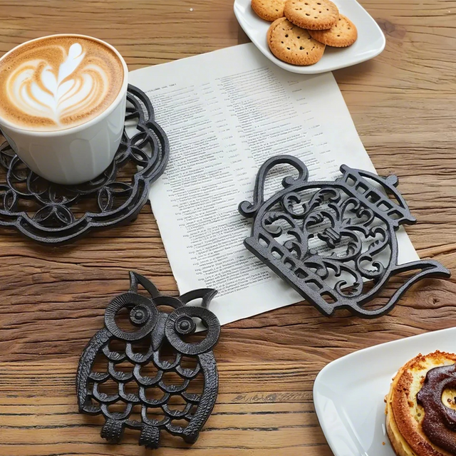 black animal shaped cast iron table coaster on the table