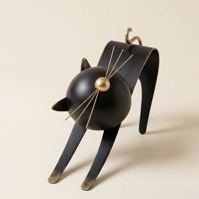 black cat sculpture gold nose close up
